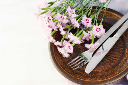 Festive table setting with flowers. Holiday table set for mother's day or birthday. Selective focus.の写真素材