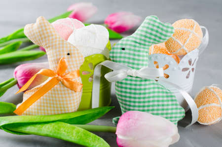 Happy Easter composition. Easter bunnies, eggs and tulips. Space for textの写真素材
