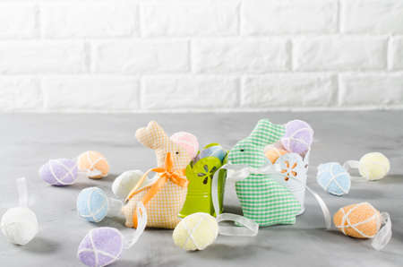 Happy Easter composition. Easter bunnies, eggs and tulips. Space for textの写真素材