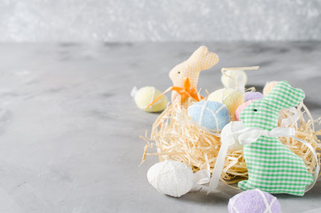 Happy Easter composition. Easter bunnies, eggs and tulips. Space for text