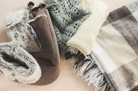 Warm home clothes. Warm woolen plaid and home slippers.