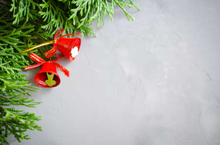 Christmas background with xmas fir branches and red bells. Christmas banner.の写真素材