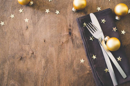 Background for writing the Christmas Menu. Winter Table Setting. Christmas tree, cutlery and fir branches. Top View, Copy Space.の写真素材