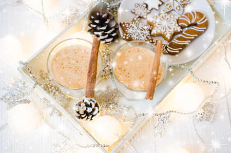 Christmas Traditional Homemade Eggnog and Gingerbread Cookies on White Background. Christmas Milk Cocktail with Spice. Selective Focus. Copy Space.の写真素材