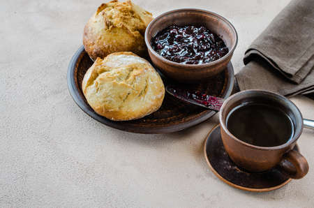 Simple breakfast: coffee americano, fresh buns and jam.の写真素材