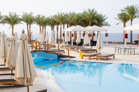 White houses and swimming pool on territory of five star hotel in Sharm El Sheikh. Summer in Egypt.のeditorial素材