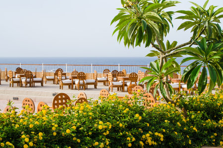 Cozy restaurant or cafe on territory of five star hotel with sea view in Sharm El Sheikh. Summer in Egypt.のeditorial素材