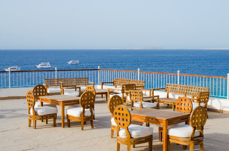 Cozy restaurant or cafe on territory of five star hotel with sea view in Sharm El Sheikh. Summer in Egypt.のeditorial素材