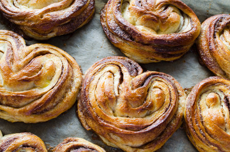 Baked fresh fragrant cinnamon buns. Traditional homemade pastries. Rustic style.の写真素材