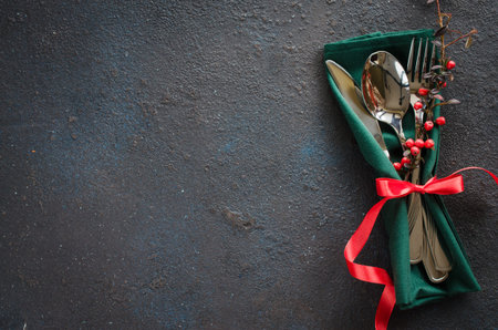 Christmas festive table setting with xmas decorations. Christmas background in rustic stile, place...