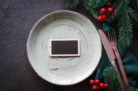 Festive table setting. Winter table set for Christmas or New Year dinner.