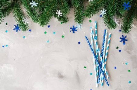 Straws with various pattern in blue color for Christmas or New Year party. Xmas background with...
