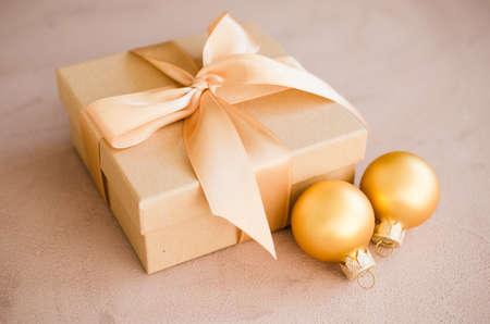 Christmas luxurious gift box with christmas balls. Elegant Christmas background with modern golden decorations. Copy space.の写真素材