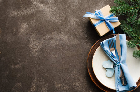 Christmas table setting. Winter background for writing the Christmas or New Year Menu. Christmas...