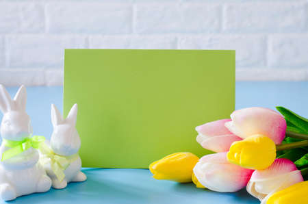 Happy Easter. Empty copyspace easter card. Easter background with decorative white rabbits.の写真素材