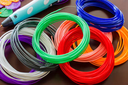 Kit colored ABS plastic in coils for 3d pen and printer. Handmade. STEM education. New technology. Hobby after school.の写真素材