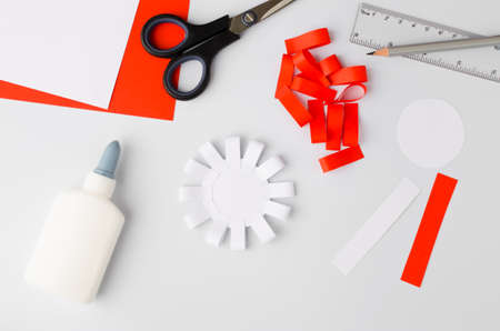 How to make polish paper cotillion at home. Step by step instruction. Step 6. National symbol of Poland. Scissors, glue, paper sheets.Top viewの写真素材