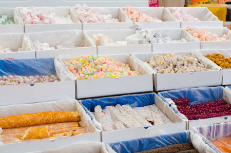 Assorted Turkish Delight. Traditional eastern sweets on market. Turkish colorful desserts Lokum....
