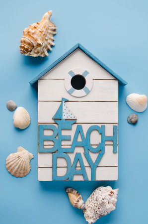 Different seashells and inscription beach day. Summer background.の写真素材
