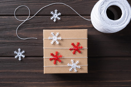 Idea gifts wrapping of the Christmas gift and decoration with decorative snowflakes. Natural design....