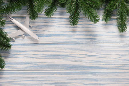 blue wooden with fir branches and plane model.の写真素材