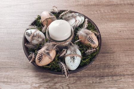 Spring decor ideas Diy. How to make Easter floral arrangement with decorative eggs, candle and moss....