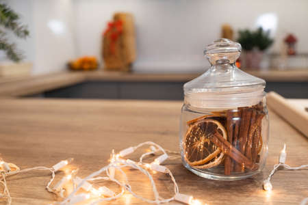 Christmas festively decorated kitchen with christmas lights, and cookie cuttersの写真素材