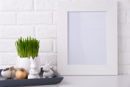 Mockup with a white frame and easter decor.