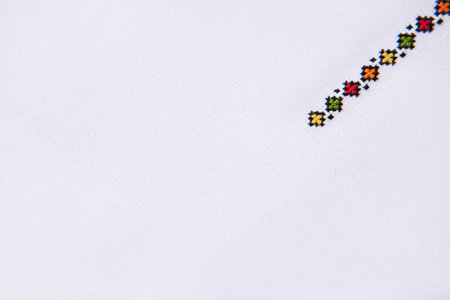 Texture of Cotton Fabric with Element of Handmade Embroidery. Design of Geometric Ethnic Pattern.の写真素材