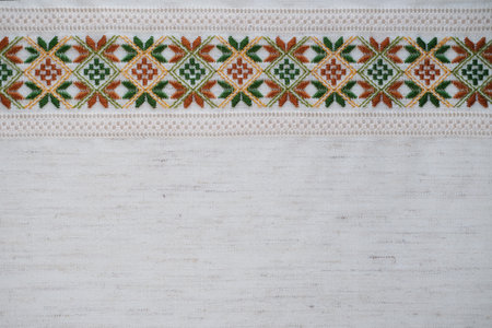 Traditional embroidered fabric with geometric patterns, ideal for ethnic designs, cultural heritage, and textile projectsの写真素材
