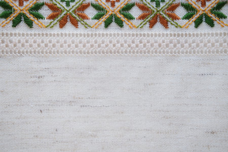 Traditional Hand-Embroidered Fabric with Geometric Floral Pattern in Earth Tonesの写真素材