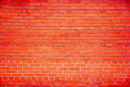bright brick wall as the background of the small bricksの写真素材