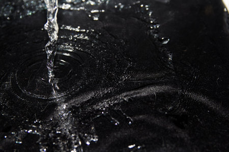 squirt, splash of water on a black background, dropsの写真素材