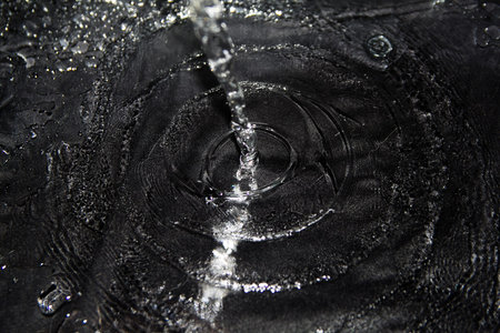 squirt, splash of water on a black background, drops