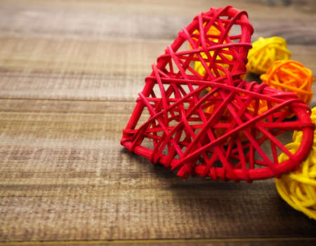 decor for Valentines day heart  , woven of red yarn, handmade,spaceの写真素材