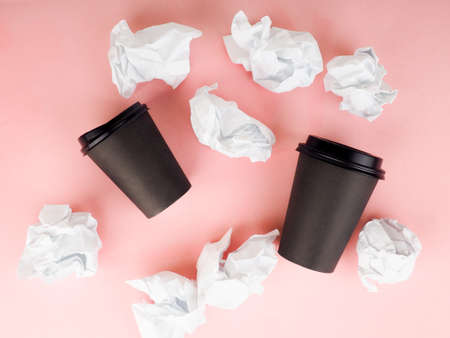 coffe cup and crumpled for idea on pink tableの写真素材