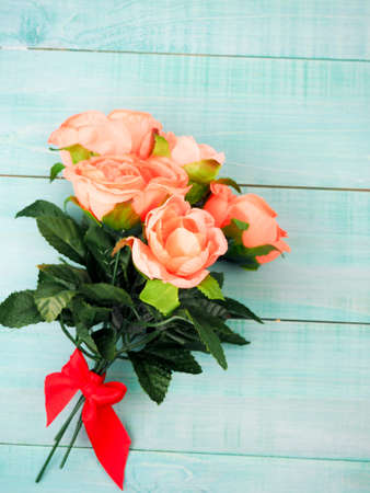 Roses on old wooden board, Valentines Day background, wedding dayの写真素材