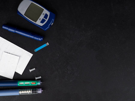 medicine, diabetes, advertisement and health care concept - close up of glucometer with blood sugar...