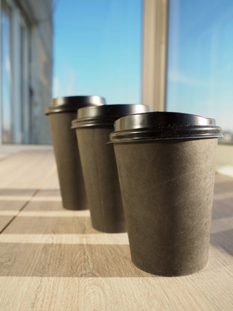 coffee in a paper Cup in the sunlight