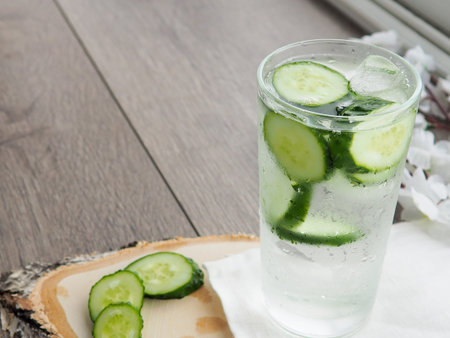 glass of cold detox with cucumber, refreshing summer drink.