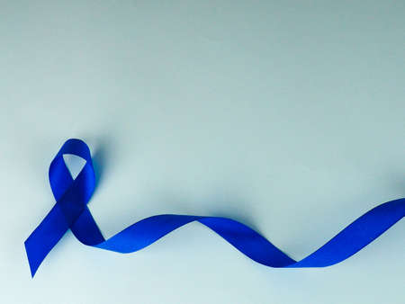 Blue ribbon awareness.Colon Cancer, Colorectal Cancer, Child Abuse awareness, world diabetes day.の写真素材