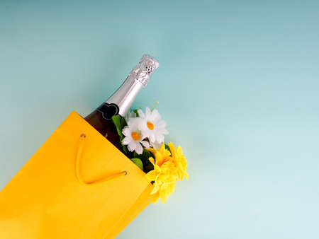 flowers in the package on blue background, space for text.の写真素材