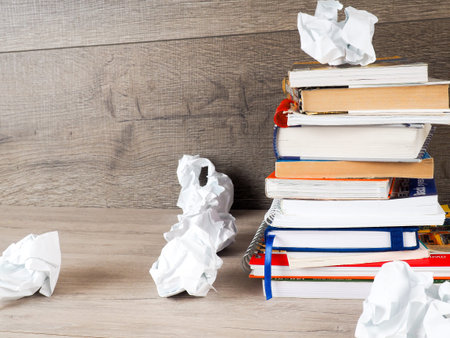 Still life with crumpled paper on books page and books stack background