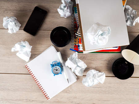 Still life with crumpled paper on books page and books stack backgroundの写真素材