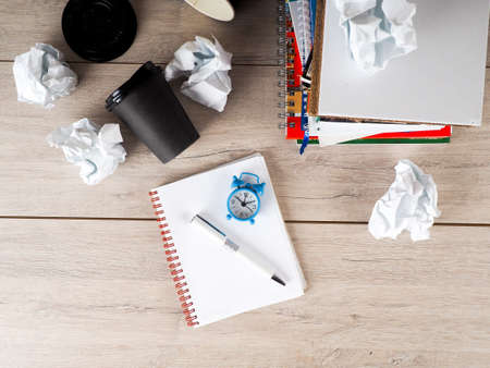 Still life with crumpled paper on books page and books stack backgroundの写真素材