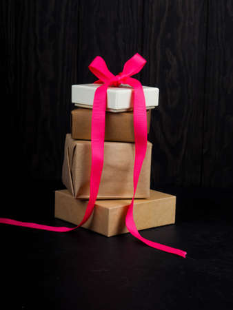 Christmas gift box. Presents in front of a black backgroundの写真素材