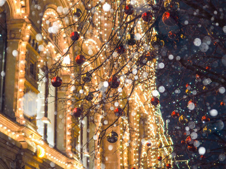 Festive illuminations in the streets of the city, Tree with bright red and yellow balls
