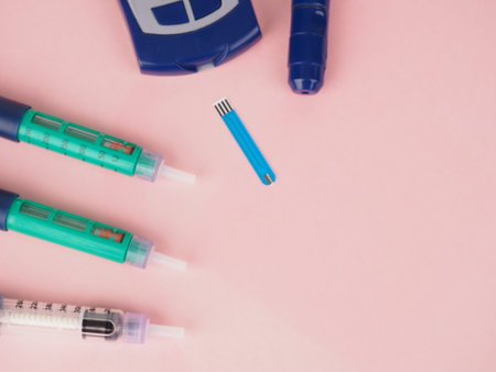 diabetes pen injection needle, syringes lie on pink background, diabetes disease concept, stop...