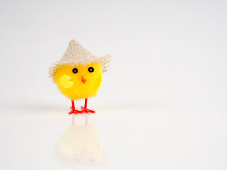 little baby toy chicken on a white background, a lot of chickens, the concept for Easter.