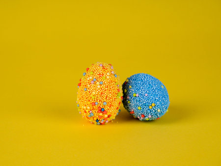 Easter holiday background. coloured decorated easter eggs on a bright yellow background